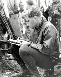 CHUCK WRITING IN HIS PERSONAL JOURNAL ON THE SET OF THE WAR LORD